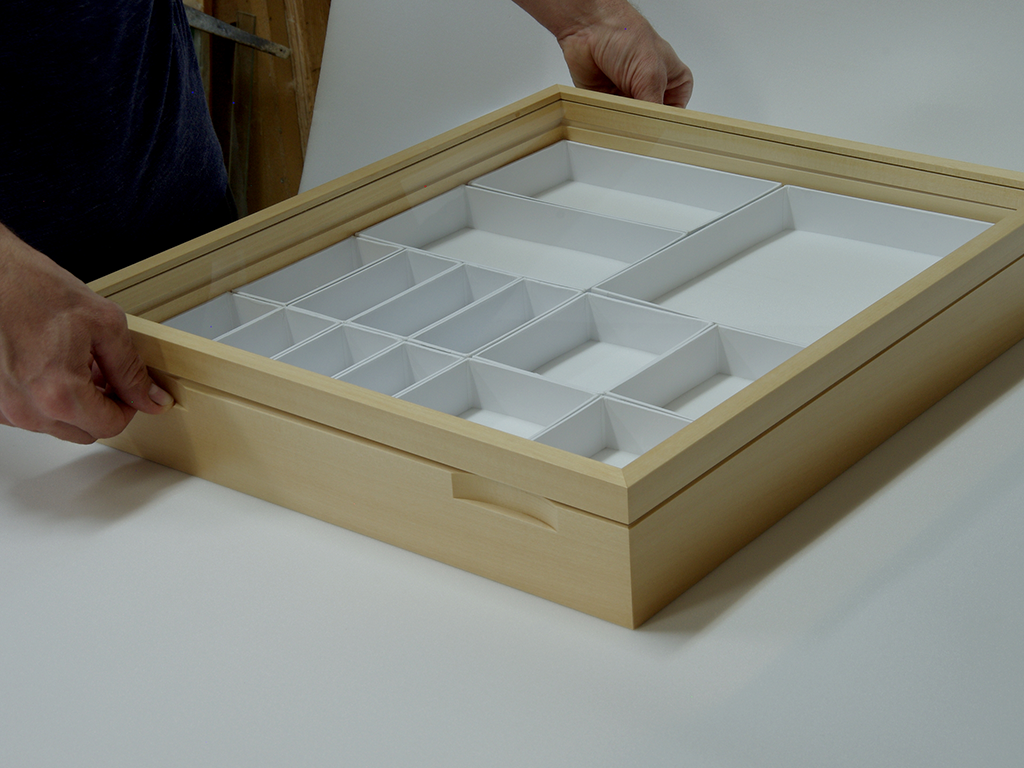 Lift the two bottom corners simultaneously, again using your thumbs and index and middle fingers.